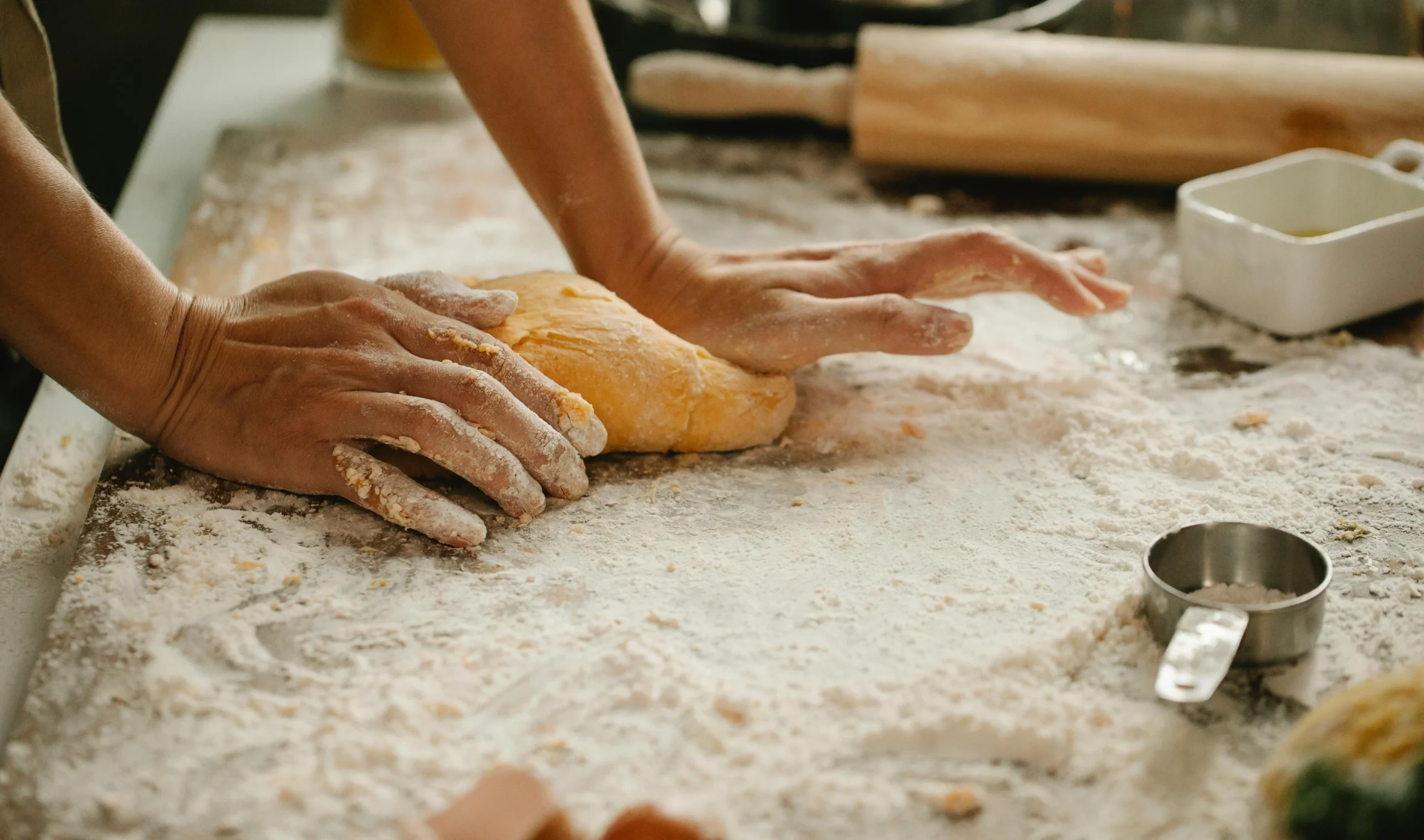 A person kneading dough.