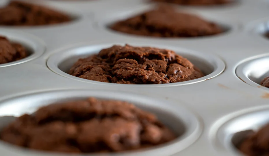 Chocolate muffins in a baking pan.